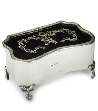 A large Edwardian shaped rectangular silver and tortoiseshell piqué box