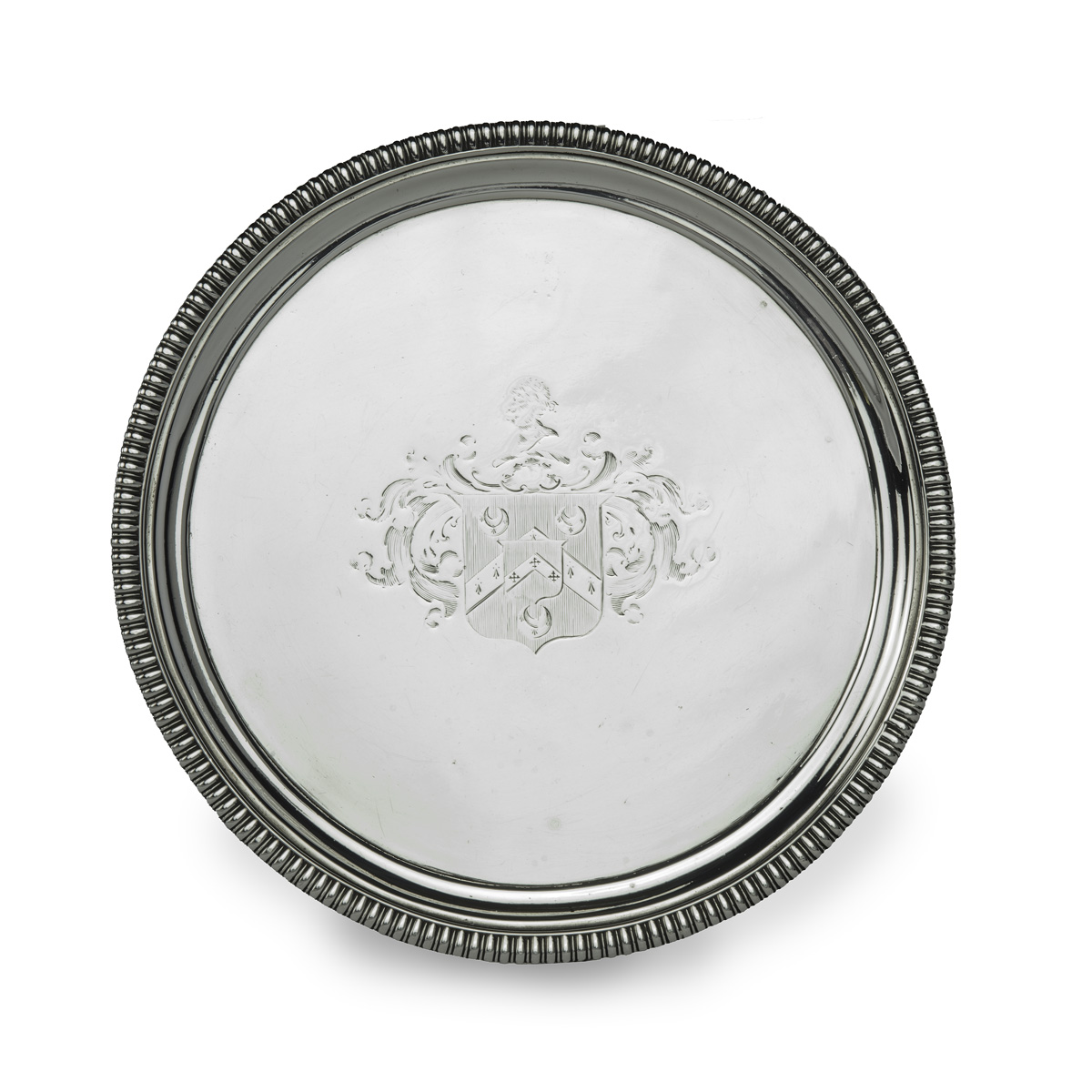 A George III silver tray commemorating the marriage of Admiral Thomas Le Marchant Gosselin, of circular form raised on three bracket feet, incised with the armorial is for the family of Gosselin with Hadsley in pretence, hallmarked to the underside for John Mewburn, London 1810.