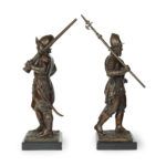 A pair of bronze standing figures of Conquistadors side