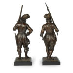 A pair of bronze standing figures of Conquistadors back