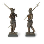 A pair of bronze standing figures of Conquistadors side