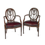 A pair mahogany Hepplewhite style arm chairs