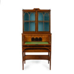 A fine late George III satinwood and snakewood secretaire cabinet, attributed to George Simson Open details