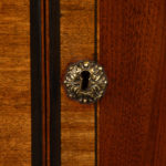 A pair of Edwardian mahogany commodes drawer key