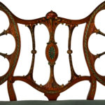 A late Victorian satinwood wheel back settee in the Chippendale style, attributed to Wright and Mansfield detail back