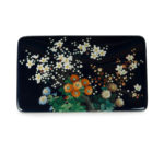 A Meiji period cloisonné box and cover, Ando Company, worked in silver wire and coloured enamels with an array of brightly coloured flowers, reserved against a rich midnight-blue ground, with silver rims and a silk lining, inlaid Ando mark.  Japanese, circa 1910 top