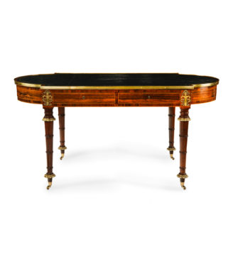 A Regency ormolu mounted rosewood two drawer writing table