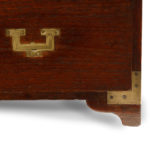 A small brass-bound teak campaign chest in two parts corner detai