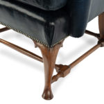 pair of walnut Georgian style leather wing armchairs leg