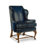 pair of walnut Georgian style leather wing armchair