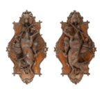 A pair of walnut Black Forest game plaques