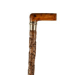 A finely carved fruitwood cane with royal and masonic symbols