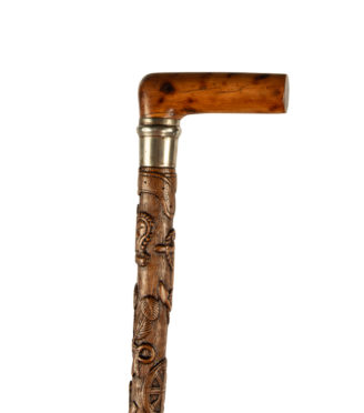 A finely carved fruitwood cane with royal and masonic symbols