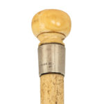 The plain whalebone cane of J Godden, dated 1896 close up