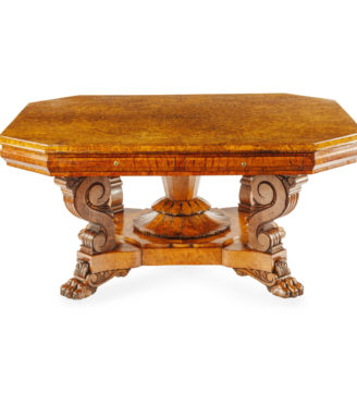 An unusual William IV amboyna and oak four drawer library table by Simpson