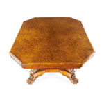 An unusual William IV amboyna and oak four drawer library table by Simpson top