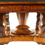 An unusual William IV amboyna and oak four drawer library table by Simpson trunk