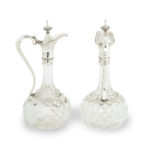 A pair of silver-mounted crystal Royal presentation claret jugs