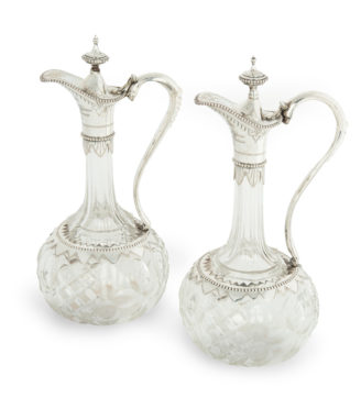 A pair of silver-mounted crystal Royal presentation claret jugs