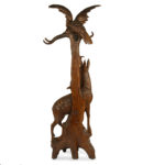 An unusual ‘Black Forest’ walnut eagle and chamois hall stand back