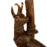 An unusual ‘Black Forest’ walnut eagle and chamois hall stand detail