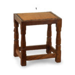 An adze cut Mouseman oak four legged stool,