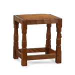 An adze cut Mouseman oak four legged stool