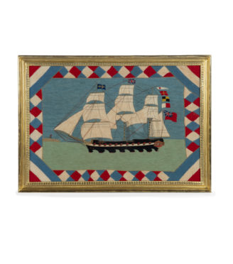 A Victorian wool picture of a three masted frigate flying several flags and ensigns