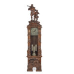 A ‘Black Forest’ linden wood long case clock by Spring of Interlaken