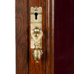 Late Victorian oak gun cabinet details lock