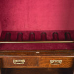 Late Victorian oak gun cabinet detail