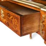 A Victorian kingwood marquetry writing table in the French taste drawer side