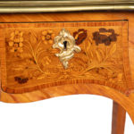 A Victorian kingwood marquetry writing table detailing