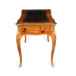 A Victorian kingwood marquetry writing table side