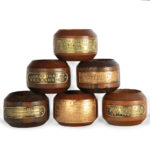 A collection of napkin rings made from the timbers of Victory, Ganges, Queen Elizabeth, Valiant, Warspite and Mauritania details