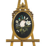 Two very similar pietra dura and ormolu photograph frames details on easels