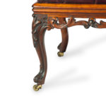 A long early Victorian rosewood stool leg detail