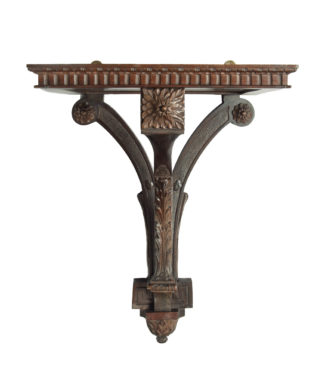 A late Victorian mahogany wall bracket for a clock, by Edwards and Roberts