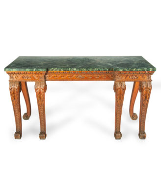 A late Victorian pitch pine console table after Linnell, the rectangular top set upon a frieze carved with Vitruvian scrolls and surmounted by a painted faux marble top, all raised upon six powerful cabriole scroll legs carved with acanthus leaves on the knees above scale pattern panels. English, circa 1900.