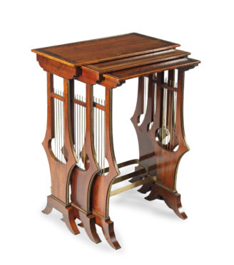 A fine and unusual nest of three Regency tables