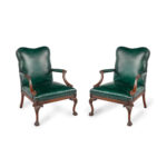 A pair of mahogany open armchairs in the style of Chippendale