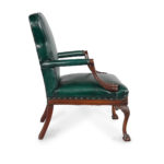 A pair of mahogany open armchairs in the style of Chippendale side profile