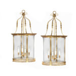 A pair of brass drum lanterns in the style of Lutyens