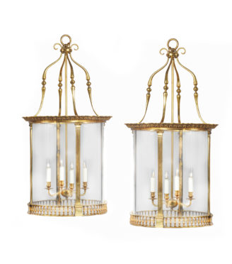 A pair of brass drum lanterns in the style of Lutyens