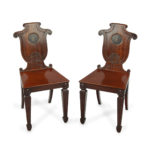 A pair of rare Regency mahogany hall chairs from the Bateson family of Belvoir Park, attributed to Seddon and Sons