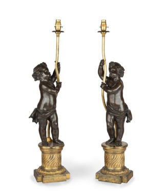 A pair of Napoleon III bronze and ormolu table lamps