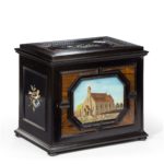 An unusual ebony bijouterie table cabinet showing Calvary Church