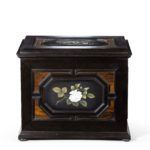 An unusual ebony bijouterie table cabinet showing Calvary Church back