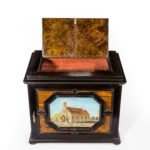 An unusual ebony bijouterie table cabinet showing Calvary Church, Stonington