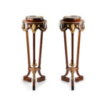 A pair of mahogany and gilt metal jardinières/torchères